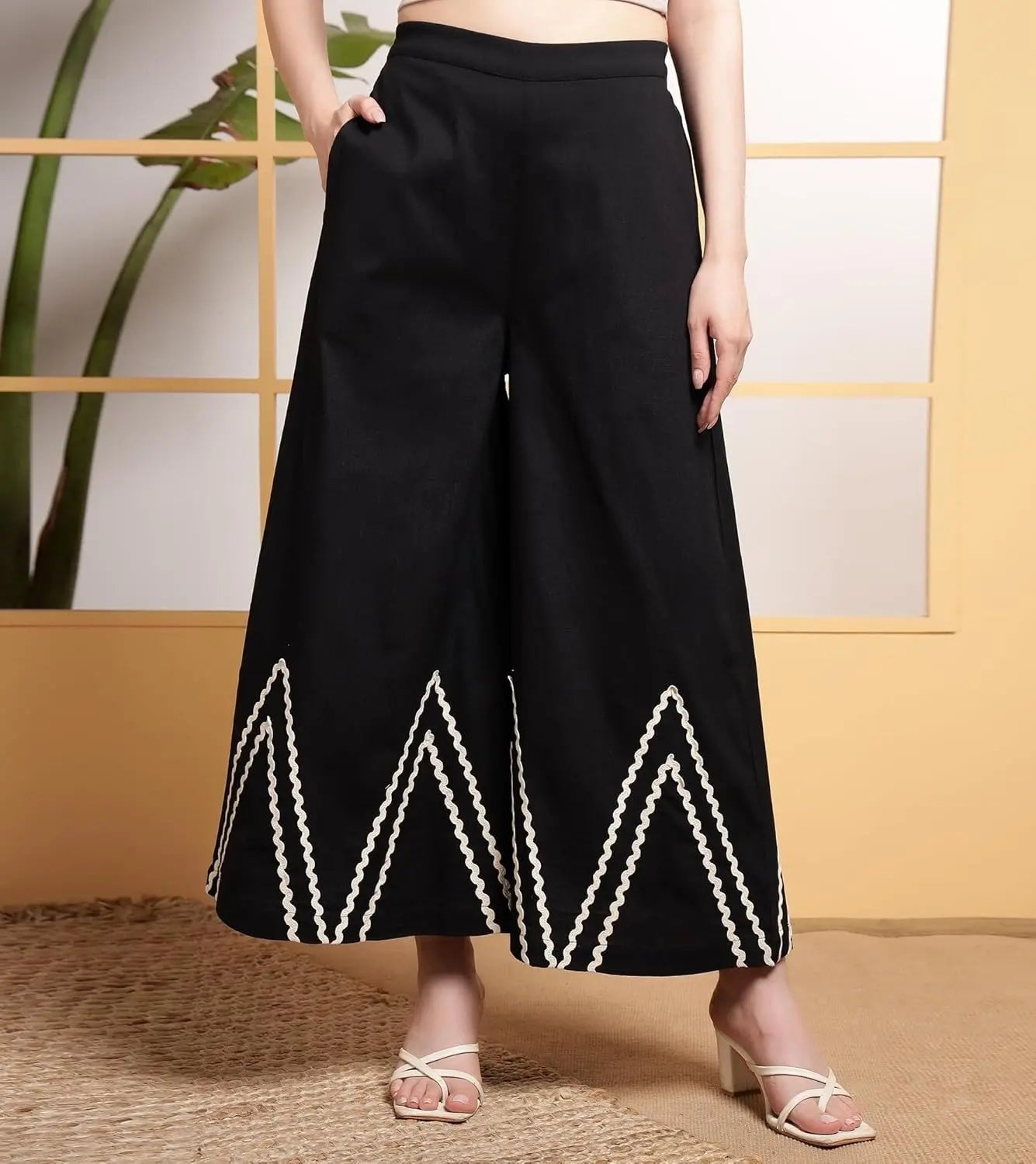 Wide-leg palazzo pants in black with white lace hem