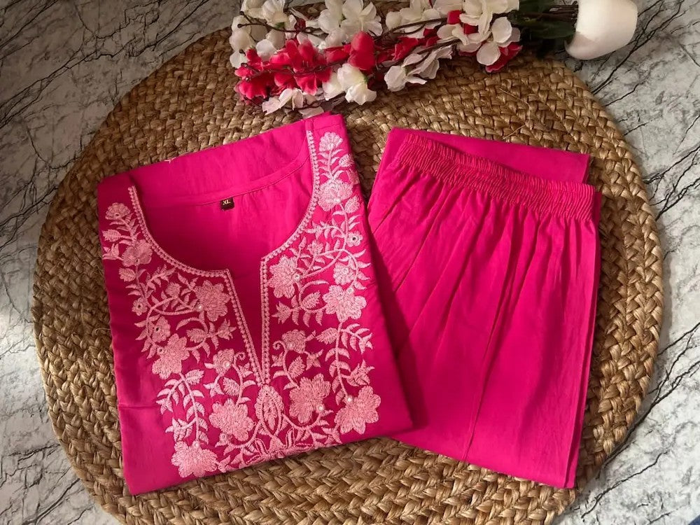 Embroidery detail on neckline and sleeves