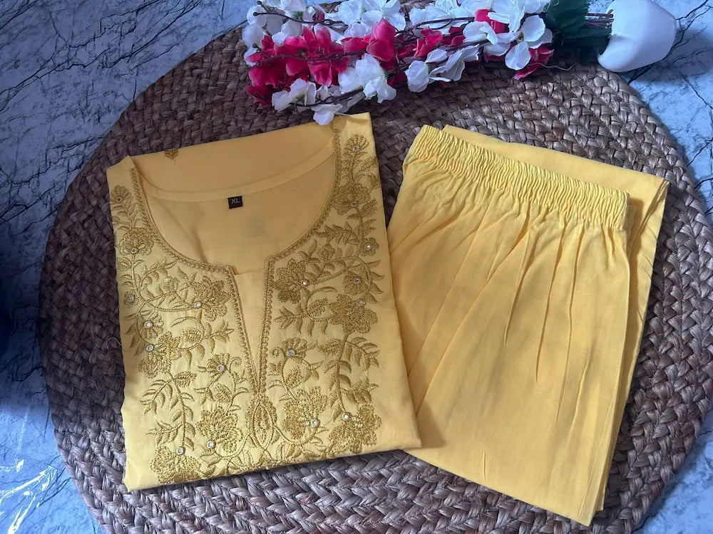 Embroidery detail on neckline and sleeves