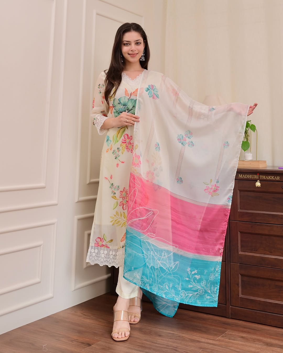Festive organza suit with zari weaving and lace neckline
