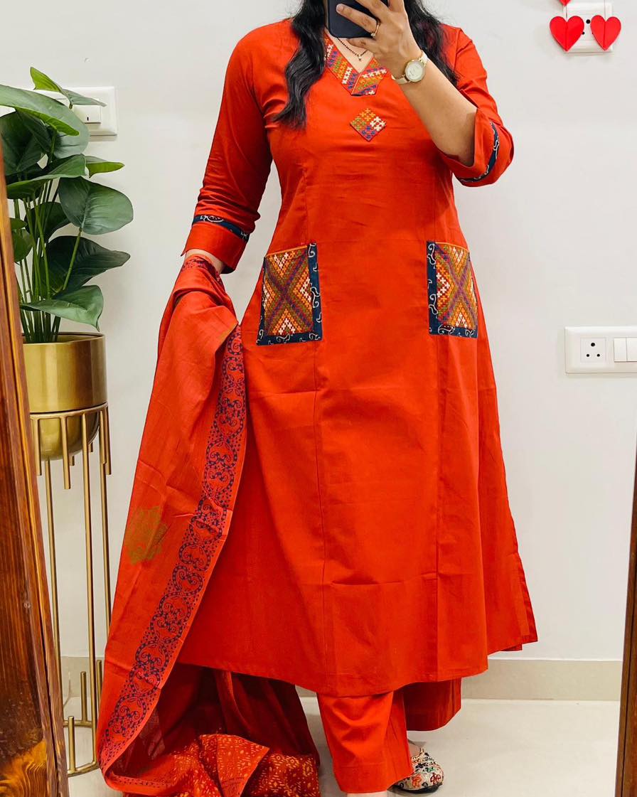 Premium cotton kurta set featuring heavy embroidery and V-neck style