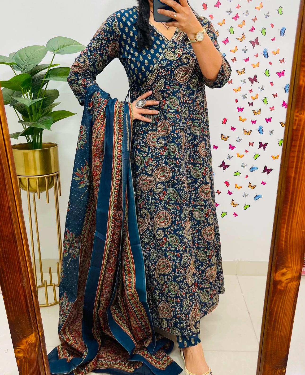 Full suit set displayed with kurti, matching pants, and dupatta.