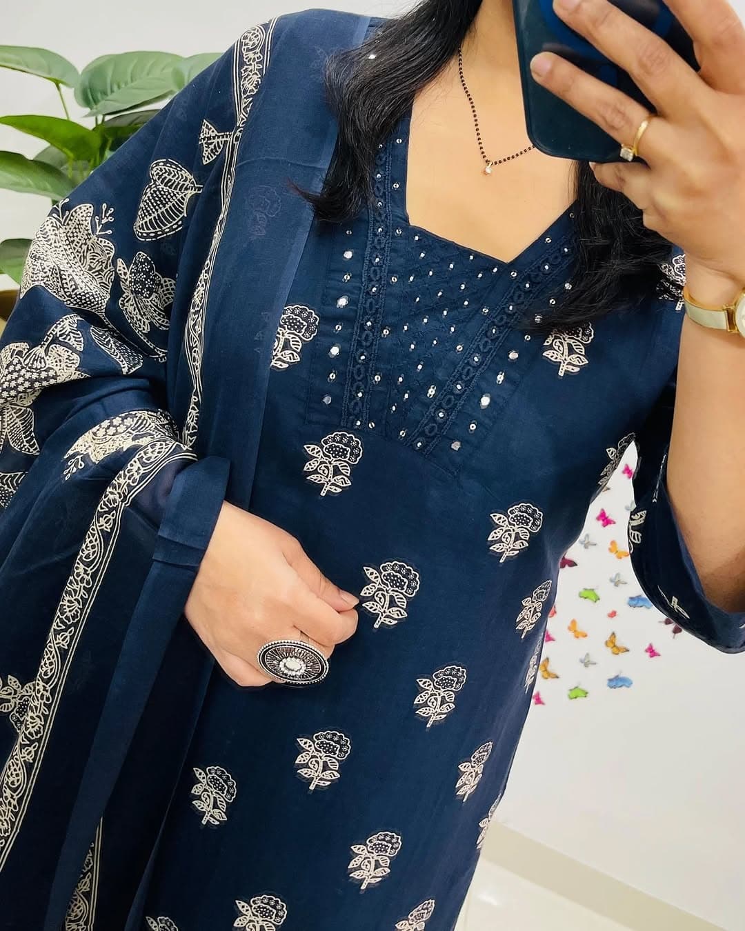 Elegant blue V-neck cotton straight-fit suit set featuring a stylish print, perfect for casual and festive wear.