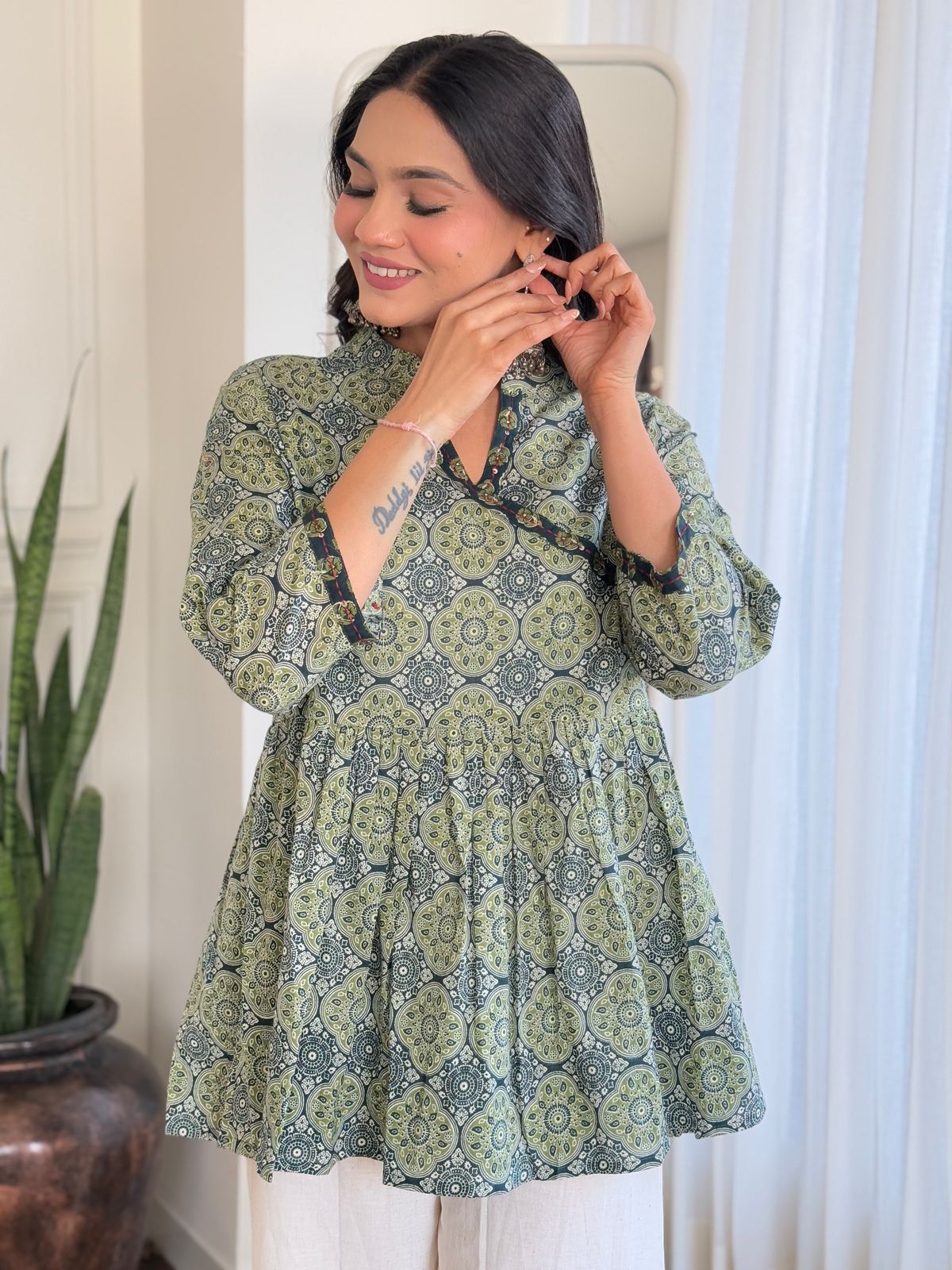 Elegant green Angrakha-style short kurti and pant set, crafted from breathable cotton for a stylish ethnic look.