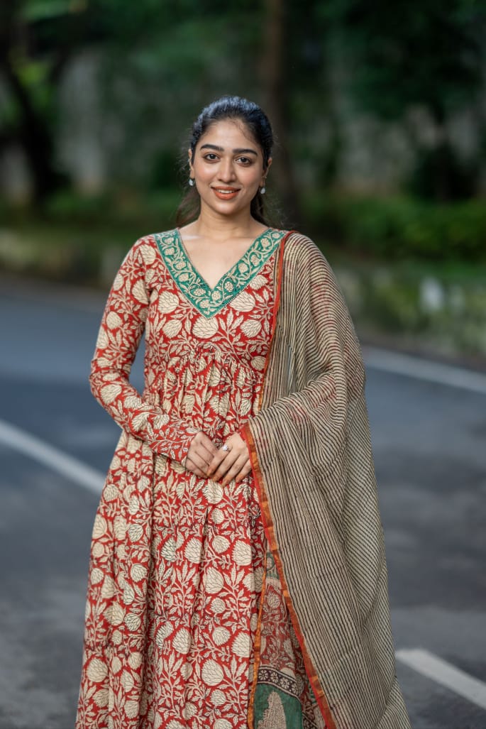 Elegant Red Cotton Printed Anarkali Suit Set with flowy silhouette, matching pants, and lightweight dupatta.