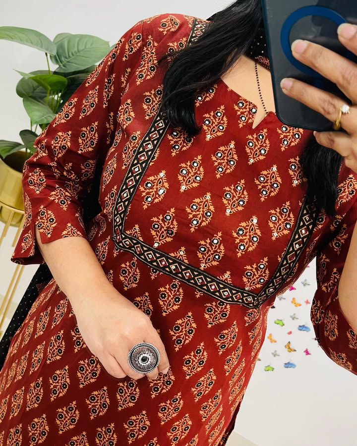 Close-up of intricate Sanganeri print on red cotton straight-fit suit