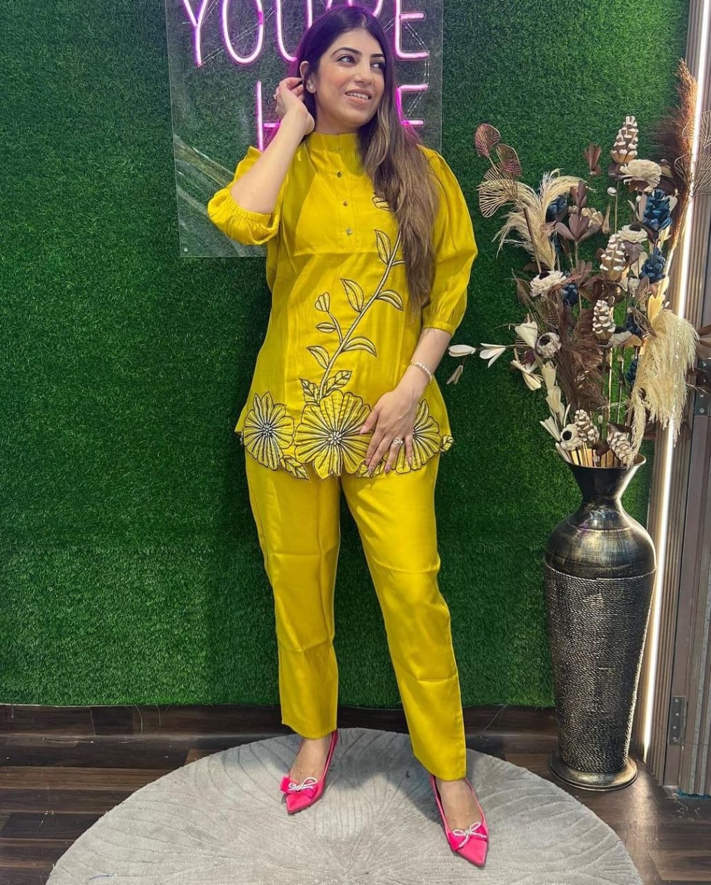 Straight-fit rayon pants paired with a stylish embroidered kurti