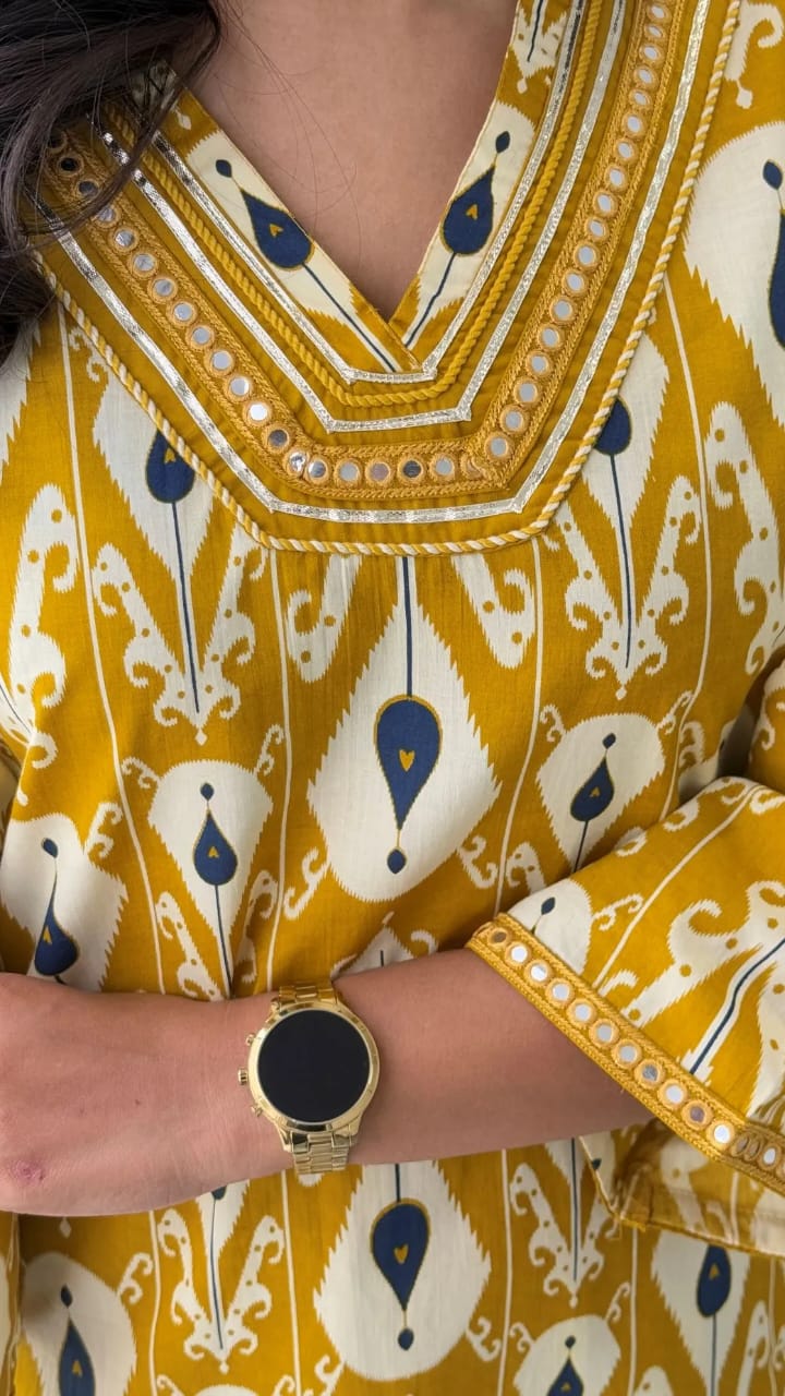 Close-up of intricate hand embroidery on the kurti sleeves and neckline