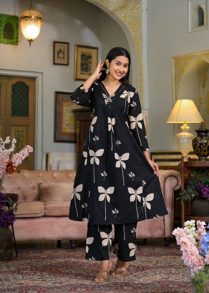 Full printed kurti and pant set laid flat

