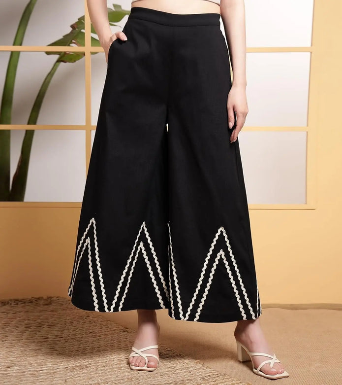 Wide-leg palazzo pants in black with white lace hem