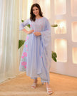 Festive cotton suit set styled on model in outdoor setting

