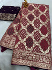 Close-up of intricate mina zari weaving on dola silk fabric