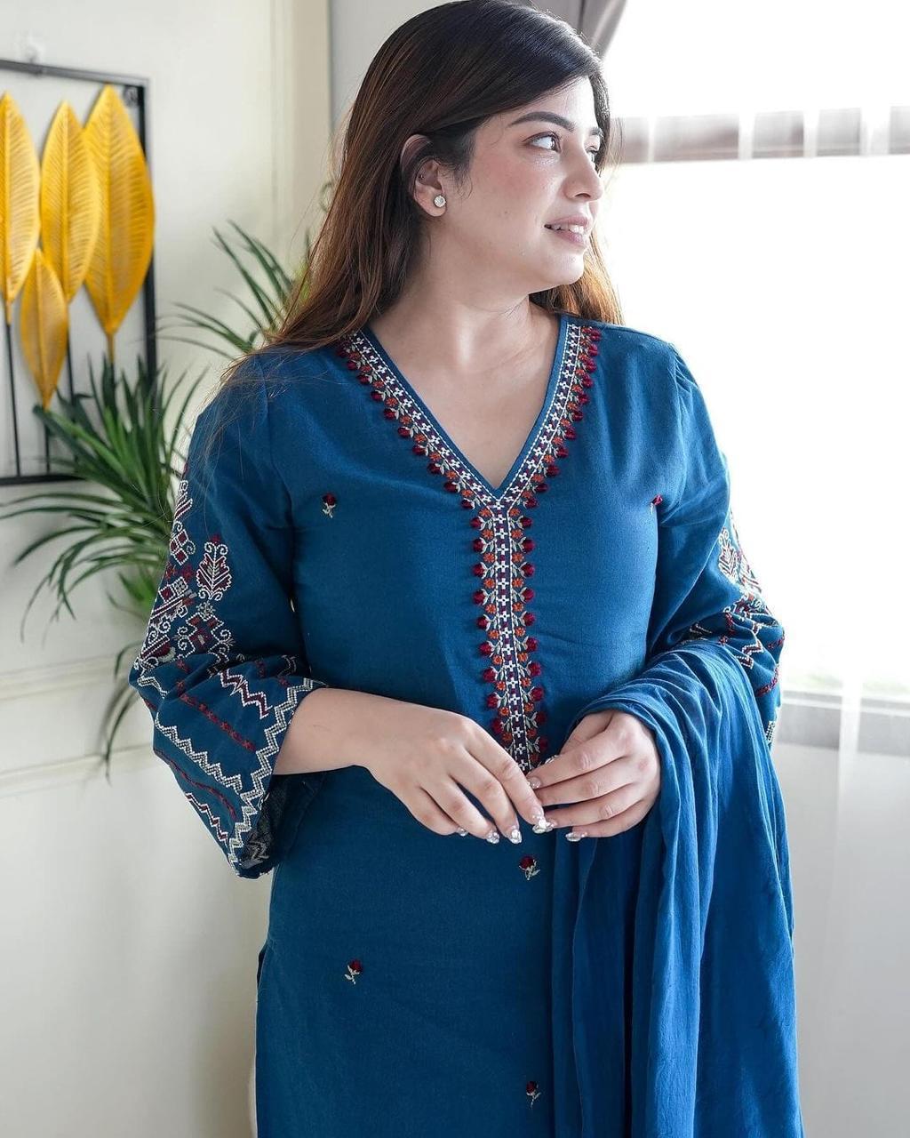Women’s cotton kurta and pant set featuring delicate embroidery work