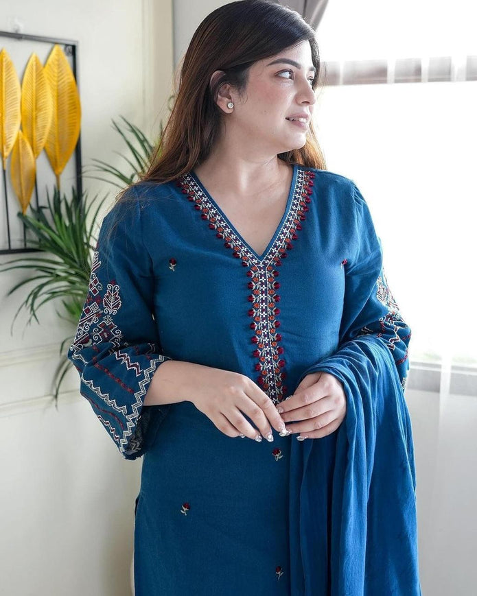 Women’s cotton kurta and pant set featuring delicate embroidery work
