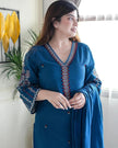 Women’s cotton kurta and pant set featuring delicate embroidery work