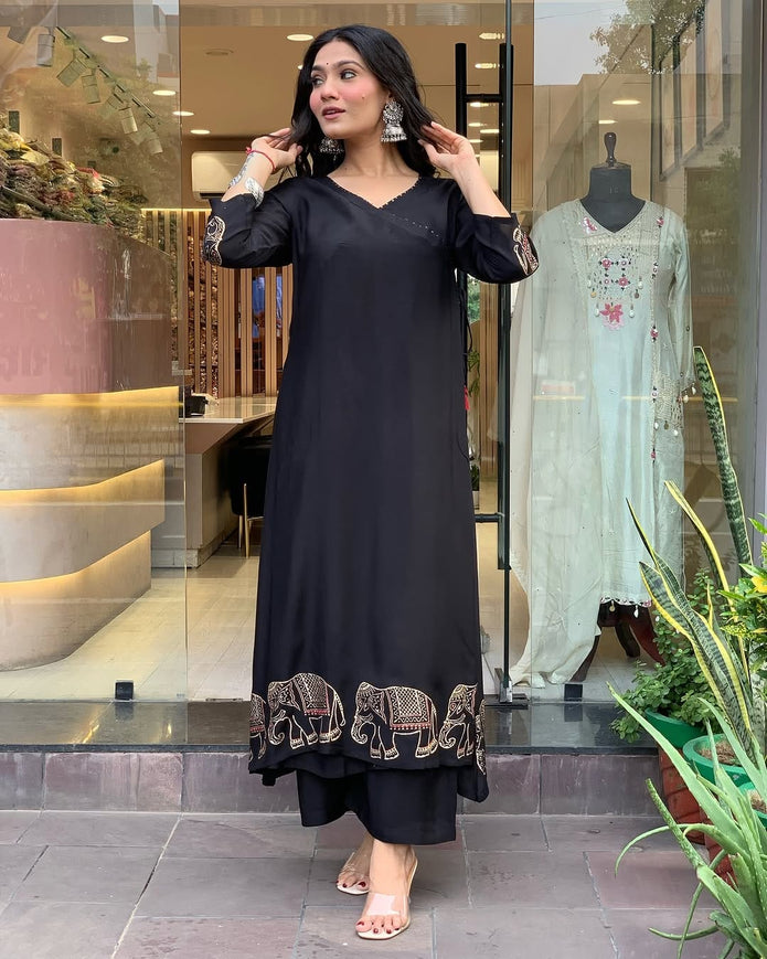Front view of embroidered cotton kurti set with matching pant in pastel shade

