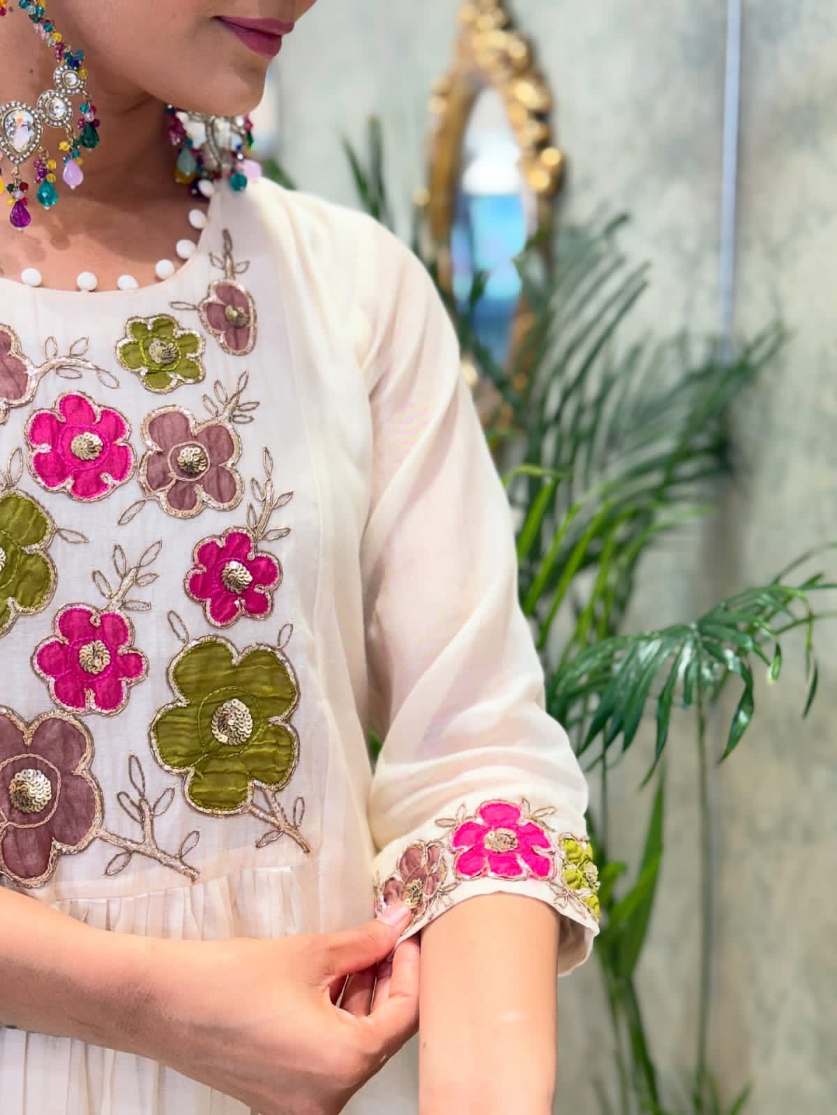 Close-up of embroidery on neckline and sleeves