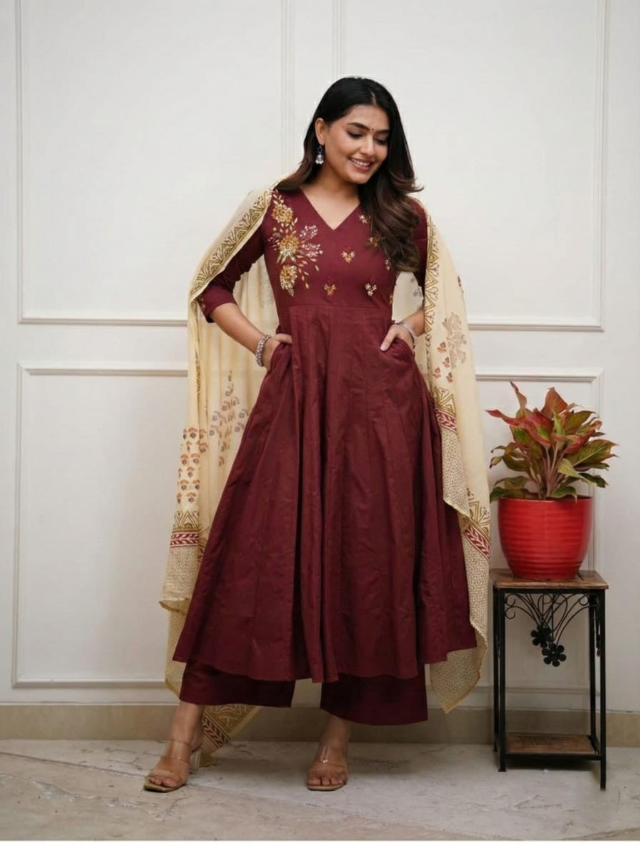 Maroon flared embroidered cotton kurta set with printed malmal dupatta