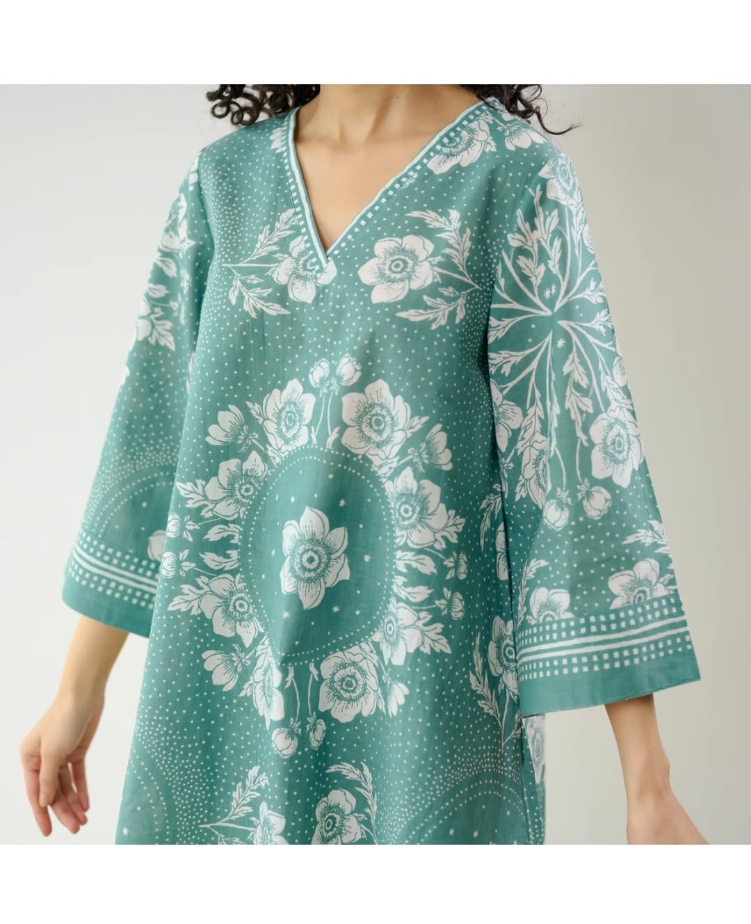 Close-up of digital floral print on blue kurta



