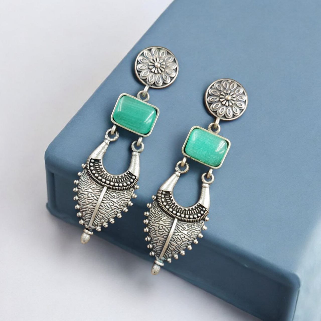 Maabetii Turquoise Silver Look- Alike Jhumka  with Square Stone