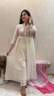 Woman wearing mul cotton kurta set with tie-dye dupatta and embroidery