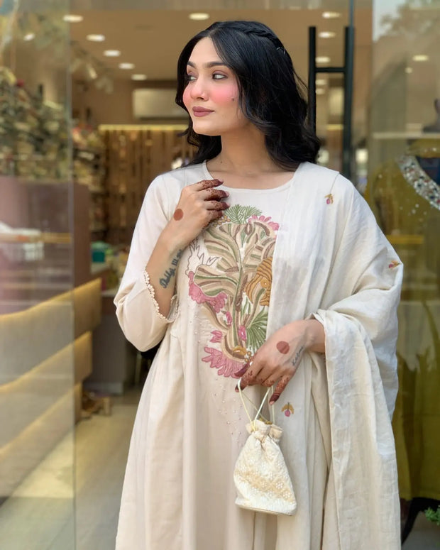 Festive cotton suit with hand embroidery and lace details

