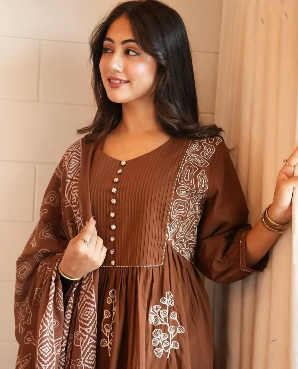 Close-up of neckline embroidery and pitten work on Anarkali kurta

