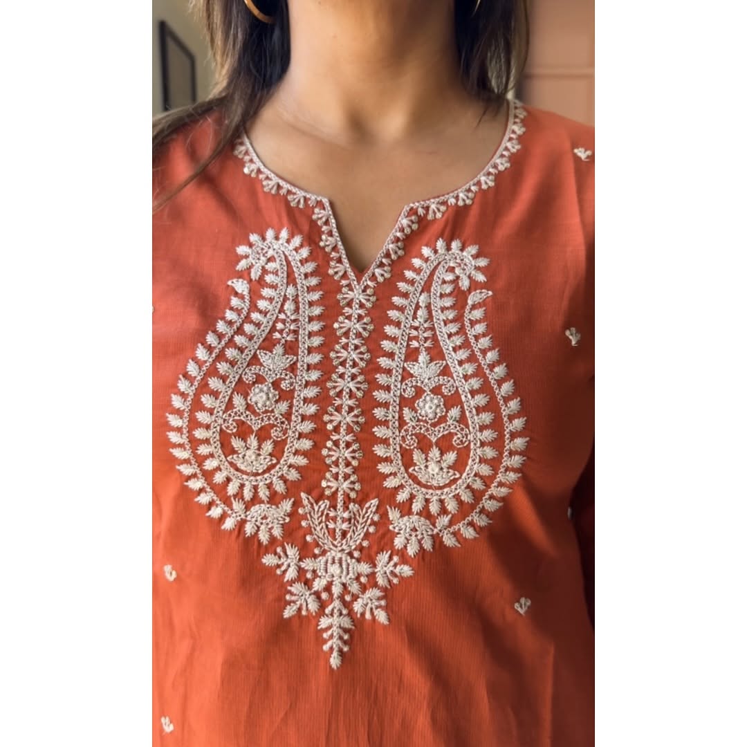 Close-up of intricate embroidery on kurta and sleeves

