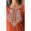 Close-up of intricate embroidery on kurta and sleeves

