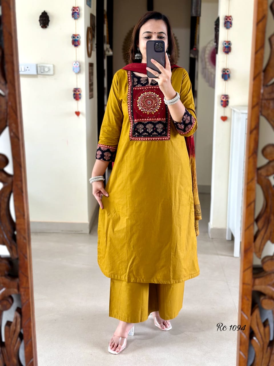 Complete set with kurti, pants, and malmal dupatta elegantly displayed

