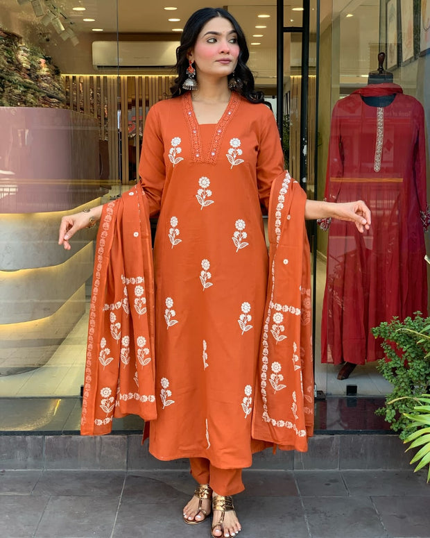 Front view of orange embroidered cotton suit with dupatta

