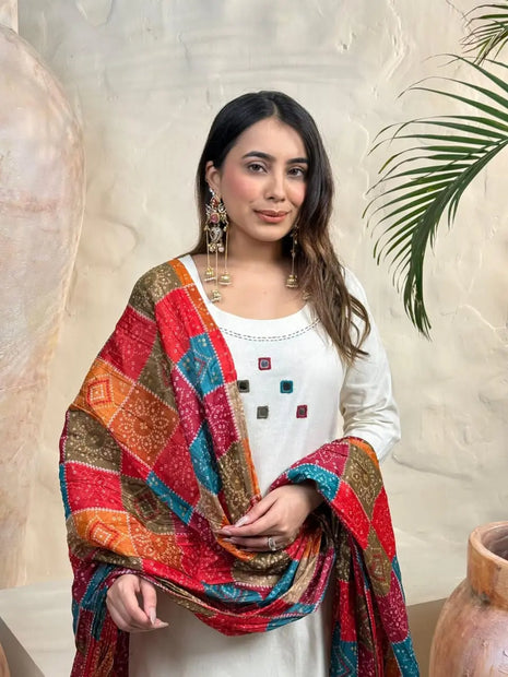 White embroidered kurti with matching pants and bandhani dupatta

