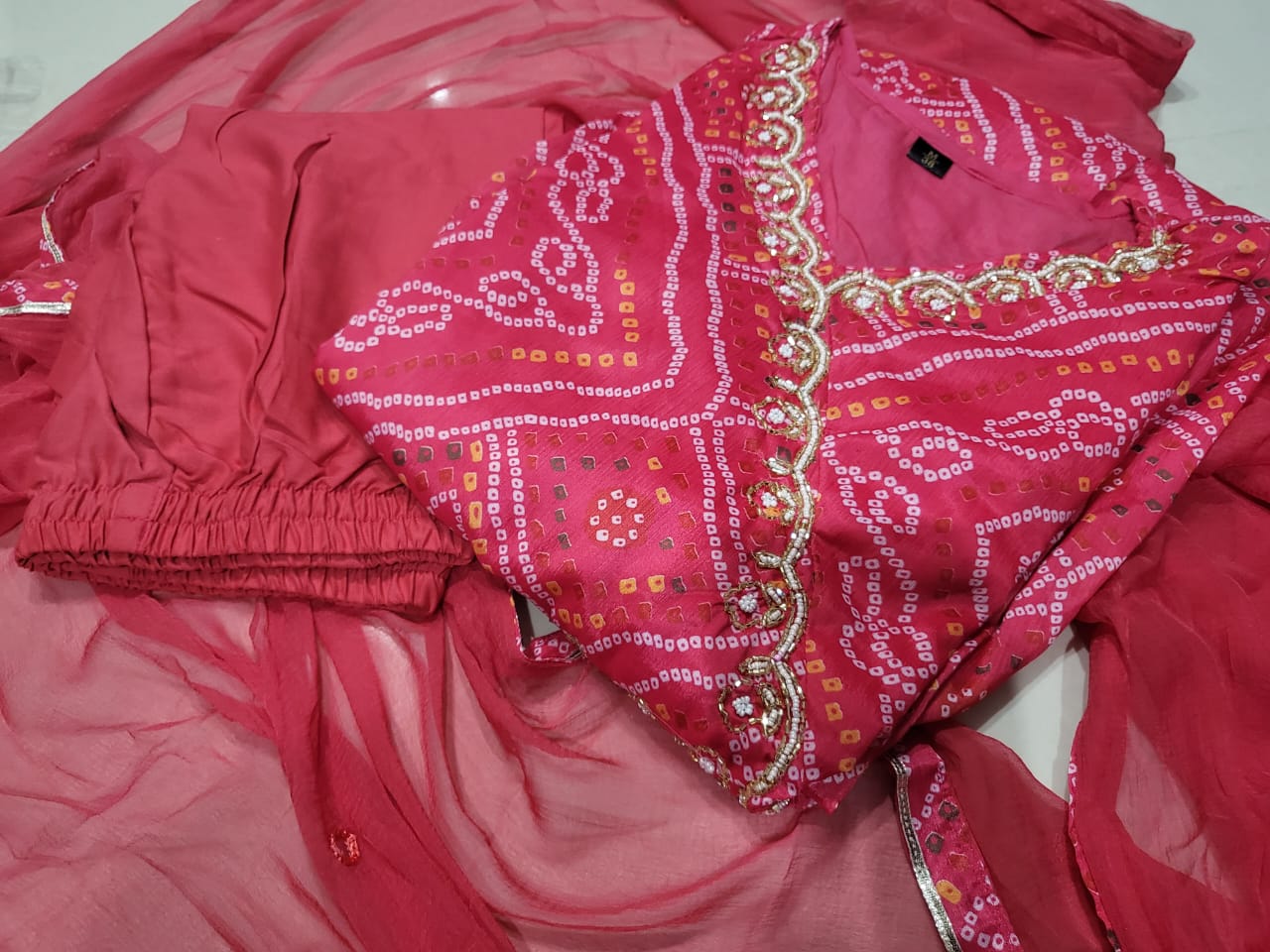 Maabetii Pink Chinon Angarkha Bandhani Suit Set