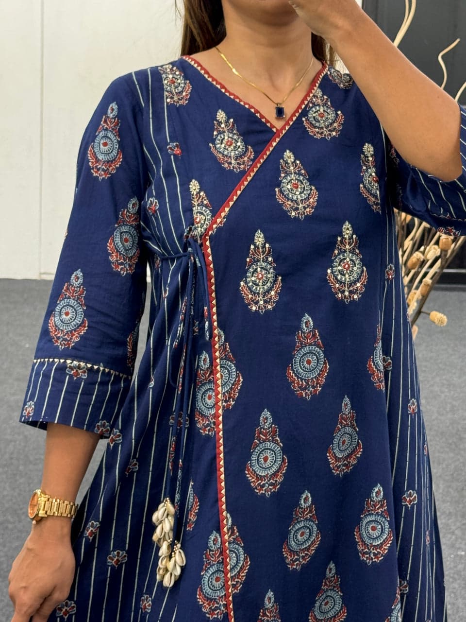 Model twirling in flowy Blue Cotton Anarkali Suit, showcasing elegant Angrakha wrap

