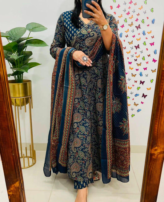 Blue cotton angrakha anarkali suit with intricate prints, styled on a model.

