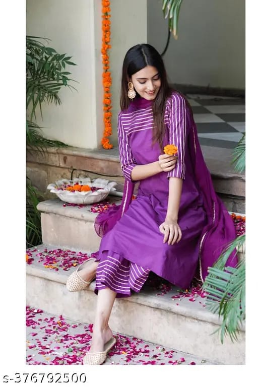 Purple rayon A-line suit set featuring elegant gota lace detailing, paired with matching straight pants and a dupatta.