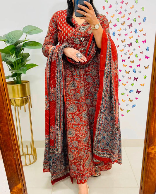 Red cotton angrakha anarkali suit set with elegant prints, styled on a model.

