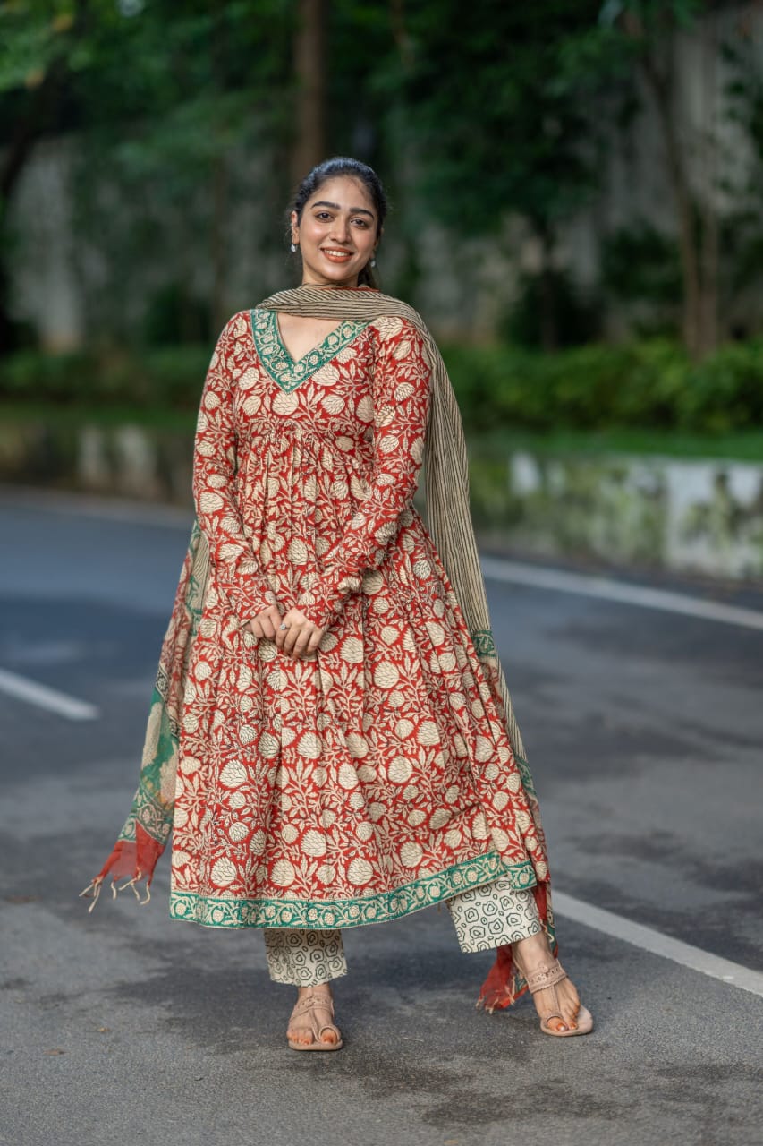Red Cotton Printed Anarkali Suit Set with matching pants and dupatta.