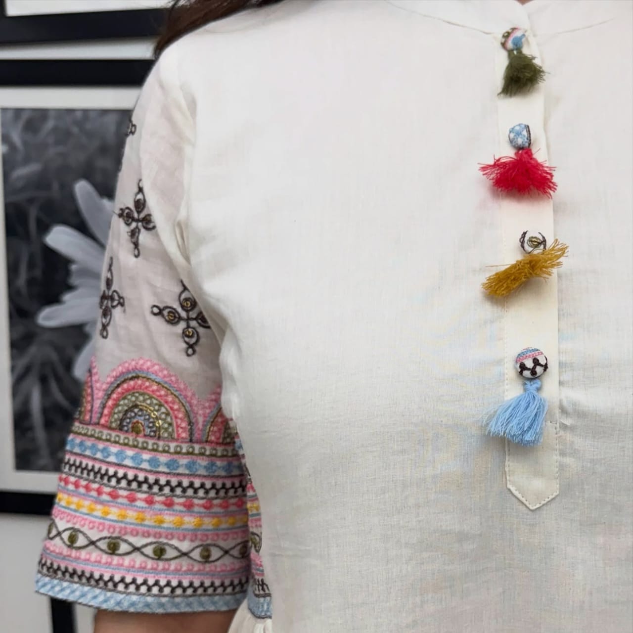 Full set laid flat showing kurta and pant

