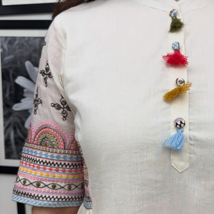 Full set laid flat showing kurta and pant

