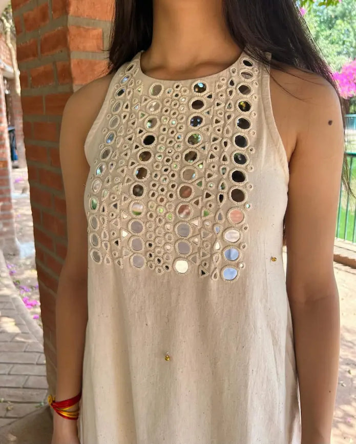 Close-up of handwork and mirror work on kurti

