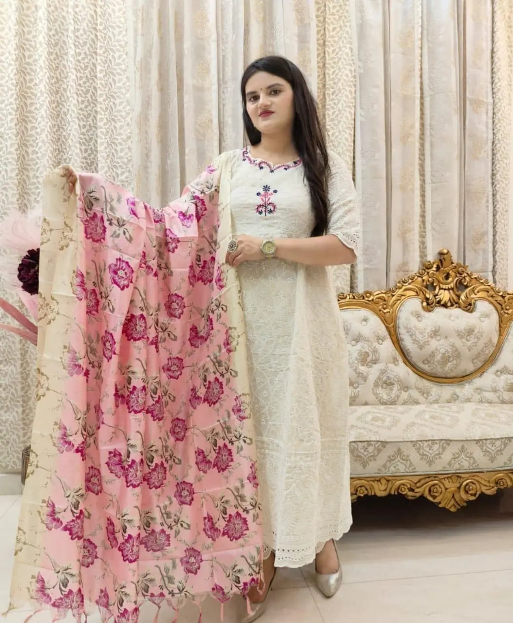 White Anarkali kurta set paired with contrasting heavy dupatta

