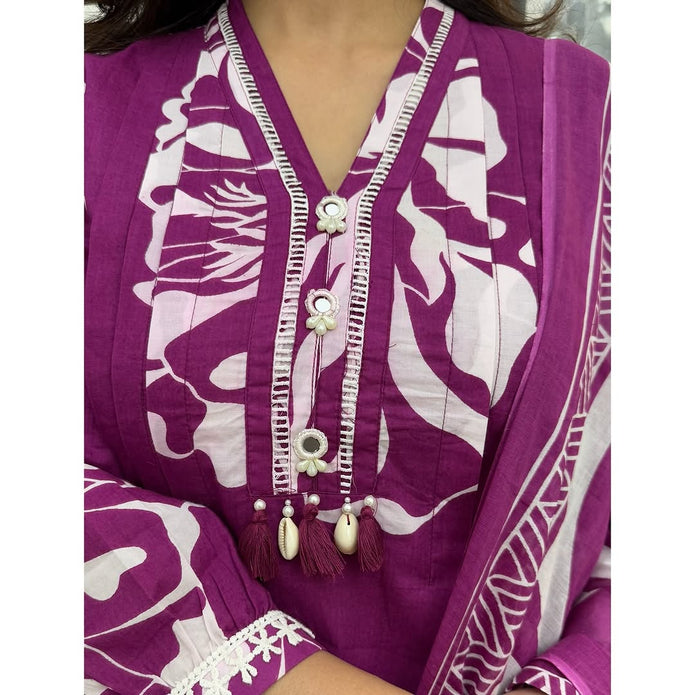 Close-up of embroidery on neckline and floral sleeves


